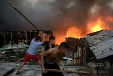 マニラ近郊のスラムで火災、約2000人焼け出されるも死者ゼロ 写真20枚 国際ニュース：AFPBB News